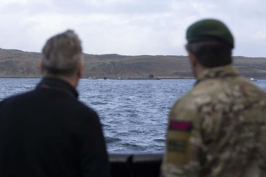 18 Apr 2026 - Prime Minister Keir Starmer and First Sea Lord, General Sir Gwyn Jenkins KCB OBE ADC looking at a Vanguard Class Submarine. The Prime Minister and Defence Secretary have welcomed Royal Navy submariners home following the completion of the UK's latest nuclear deterrent patrol. Prime Minister Keir Starmer and Defence Secretary John Healey MP joined the First Sea Lord, and Chief of Defence Nuclear on the Clyde to welcome home the Vanguard-class submarine as it returned from patrol. The submarine was deployed on Operation Relentless, the UK's Continuous At Sea Deterrent (CASD), which has ensured at least one nuclear-armed ballistic missile submarine has been on patrol, undetected, every minute of every day since April 1969. After meeting submariners onboard, the submarine, the Prime Minister and Defence Secretary were hosted by the First Sea Lord at HM Naval Base Clyde where they met personnel from 43 Commando who help protect the base and submarines. The Prime Minister, Defence Secretary and First Sea Lord also spent time with submariners and their families gathered at the base for a welcome home event organised by Naval Base staff and the Naval Service Family and People Support (NSFPS) team.