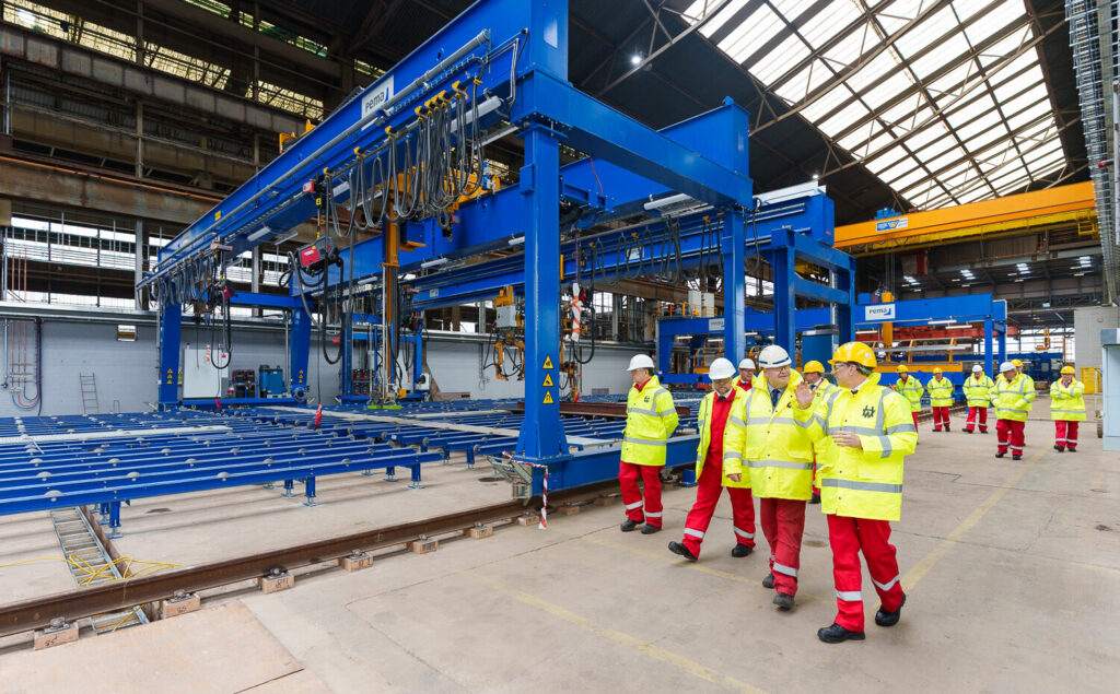 Commodore Sam Shattock, head of the Royal Fleet Auxiliary, and Rear Admiral Matthew Stratton, Director Naval Acquisition, have toured Navantia UK's Harland & Wolff shipyard in Belfast as investment in the Fleet Solid Support (FSS) programme surpassed £98.5 million.