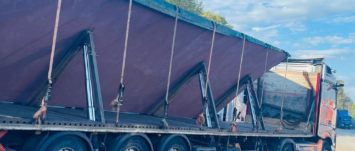When a primary logistics provider failed to deliver, a defence manufacturing programme faced potential disruption due to delayed raw materials. An international defence contractor required the urgent transport of 28 oversized plate steel sheets - essential inputs for production - across a distance of more than 1,100 miles into mainland Europe. With production timelines already under pressure, any delay risked halting manufacturing activity and impacting downstream schedules. Situations like this are where Priority Freight’s time-critical expertise is routinely applied. Acting immediately, the team mobilised a coordinated logistics solution covering transport, customs and real-time visibility, ensuring full control from collection through to final delivery. Each steel sheet presented significant transport challenges due to its size and weight. Under normal conditions, the load would require wide-load permits, introducing additional administrative delays that the programme could not accommodate. Drawing on deep operational experience, Priority Freight engineered an alternative solution using hydraulic inclined trailers, allowing each sheet to be transported at a 45-degree angle. This removed the requirement for wide-load permits entirely, accelerating mobilisation while maintaining full compliance. Despite a public holiday in Scotland, Priority Freight leveraged its established carrier network to secure immediate vehicle availability. The consignment was split across three dedicated trailers, each carrying 15 tonnes, with loading completed over a two-day window while documentation, customs pre-clearance and delivery scheduling were progressed in parallel. Within 48 hours of the initial request, the convoy was in motion. Throughout the journey, Priority Freight’s control centre teams maintained continuous oversight, with real-time tracking and proactive communication ensuring full visibility at every stage. This enabled precise coordination at destination, including the scheduling of lifting equipment and site readiness aligned to arrival. The result was a fully controlled, compliant and accelerated delivery - completed eight days ahead of the contractual deadline. Without rapid intervention, the delay of these materials would have halted production and created wider programme disruption. Instead, Priority Freight ensured continuity, demonstrating how agile planning and experienced execution protect critical manufacturing operations. This is where Priority Freight teams excel – applying speed, expertise and control to deliver supply chain certainty in complex, high-pressure environments. t +44 (0)203 805 77 33 e info@priorityfreight.com www.priorityfreight.com ABOUT PRIORITY FREIGHT Priority Freight is a leading time-critical logistics specialist, operating 24/7, 365 days a year. With several strategically-located control centres across Europe, and a global network of agents, the company provides bespoke, global solutions for even the most complex logistics challenges. By partnering with and supporting its clients, the company adds speed and flexibility to their supply chains, ensuring each consignment is delivered on time and in perfect condition every time. Priority Freight’s highly experienced team of multilingual logistics specialists are committed to providing the fastest, most cost-effective and reliable solutions, time and time again. With a reaction time of under 15 minutes, and an on-time delivery rate of 99.6%, it is this dedication that has seen the company achieve a high client satisfaction score.